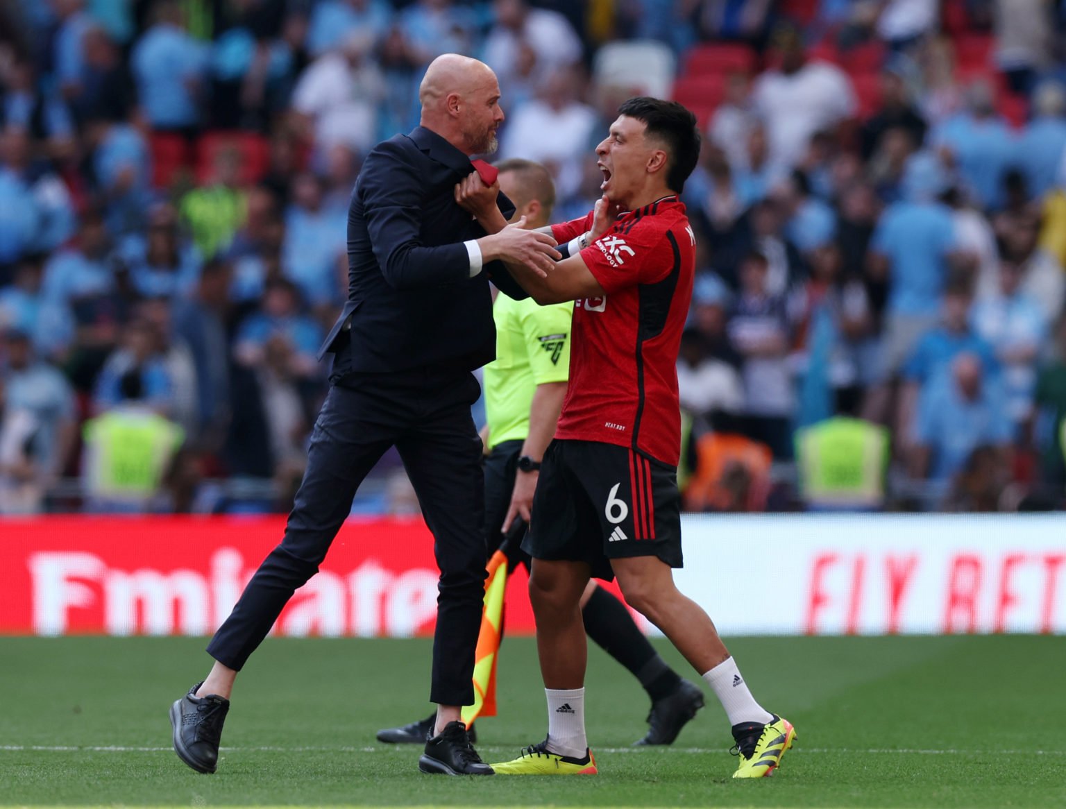 Manchester United manager Erik ten Hag celebrates with Manchester United's Lisandro Martinez after winning the Emirates FA Cup Final match between ...