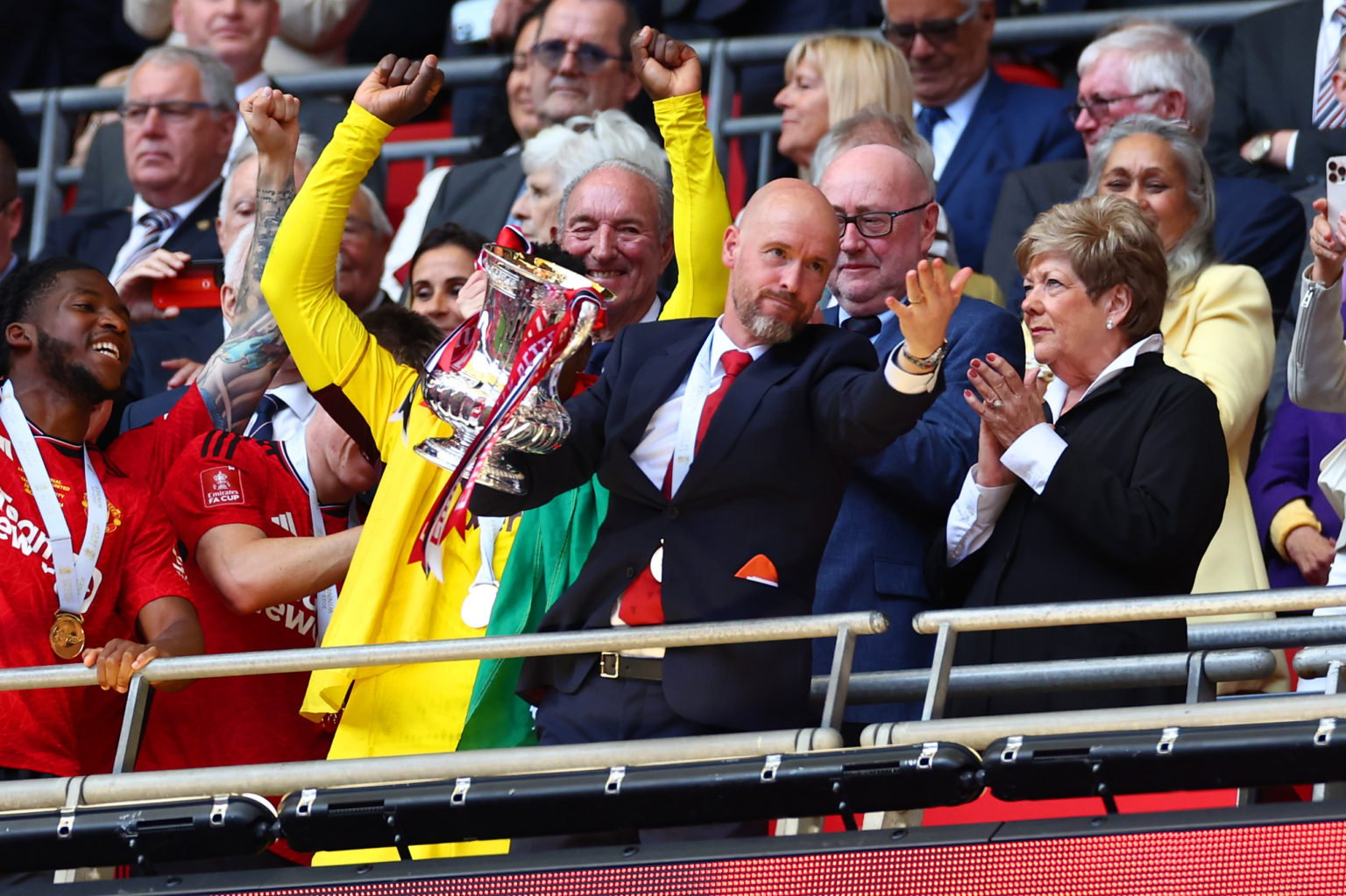 Manchester United manager Erik Ten Hag lifts the trophy following the Emirates FA Cup Final match between Manchester City and Manchester United at ...