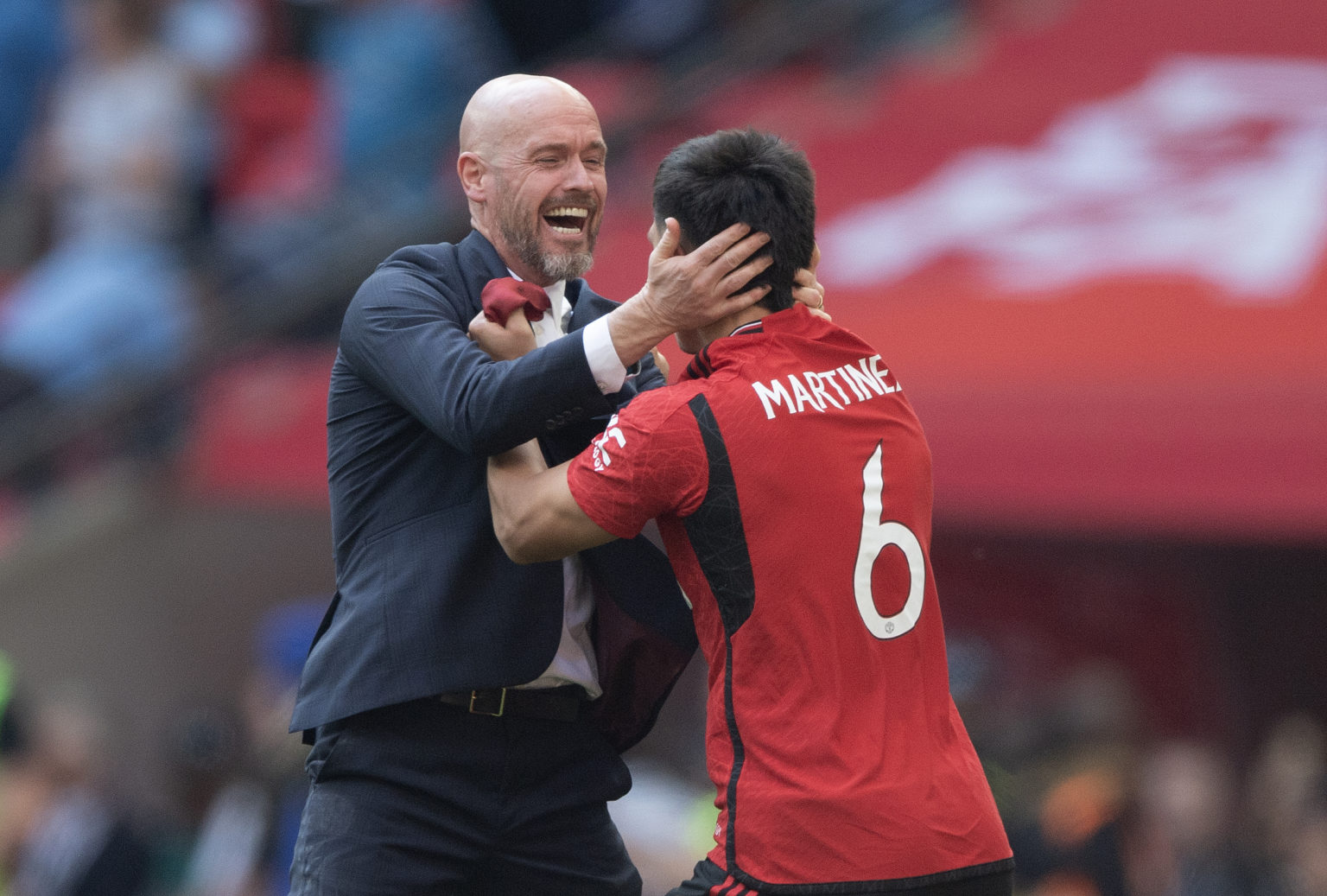 Manchester United manager Erik ten Hag celebrates victory with Lisandro Martinez after the Emirates FA Cup Final match between Manchester City and ...