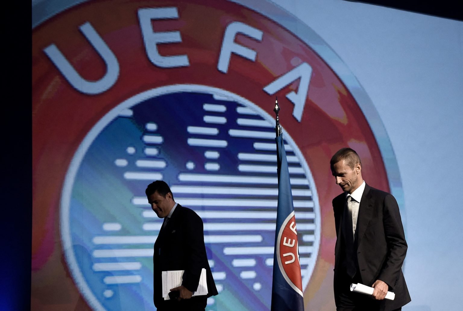 UEFA's newly elected President, Slovenian Aleksander Ceferin (R) leaves after a press conference during the 12th Extraordinary UEFA congress and Pr...