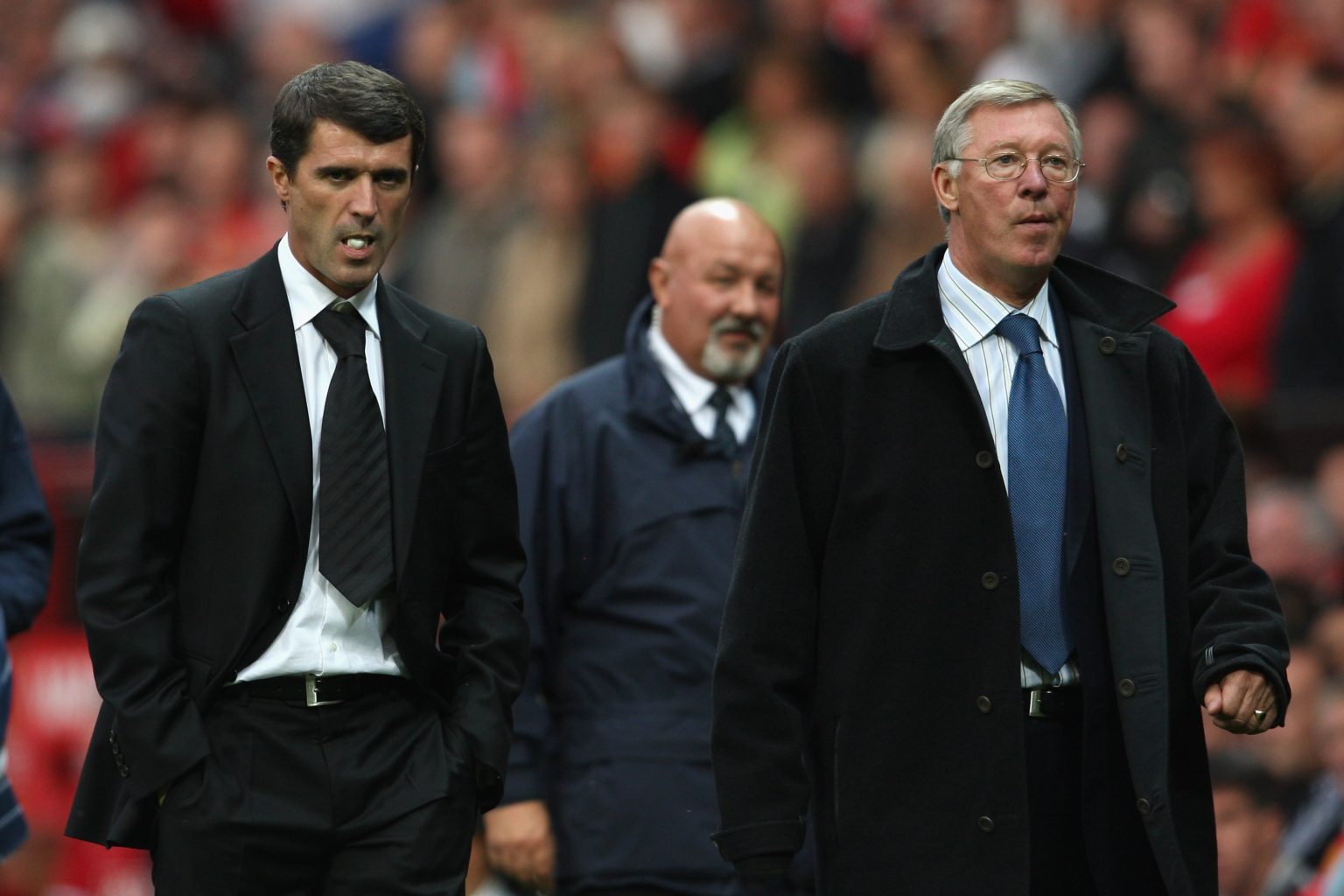 Manchester United Manager Sir Alex Ferguson (R) and Sunderland Manager Roy Keane leave the playing area at the end of the Barclays Premier League m...