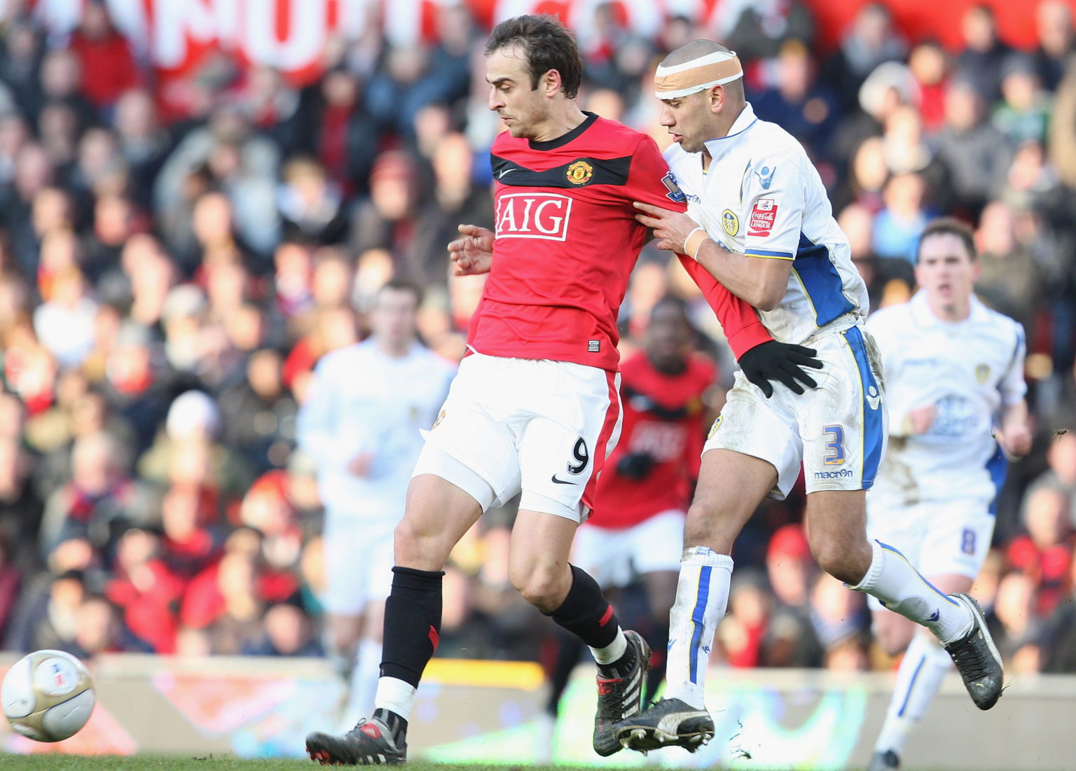 Dimitar Berbatov of Manchester United clashes with Patrick Kisnorbo of Leeds United during the FA Cup Sponsored by E.On Third Round match between M...