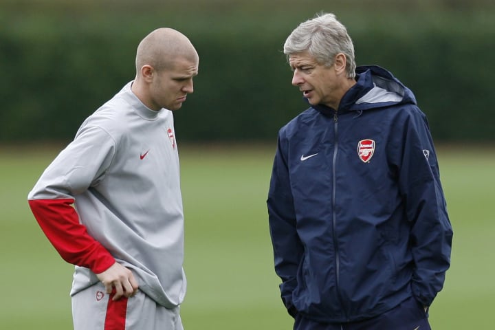 Arsenal Manager Arsene Wenger (R) talks