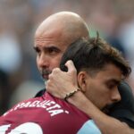 Manchester City Manager Pep Guardiola (R) and Lucas Paqueta of West Ham United embrace prior to the Premier League match between West Ham United an...