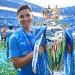 Julian Alvarez of Manchester City holds the trophy after the Premier League match between Manchester City and West Ham United at Etihad Stadium on ...