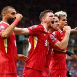 Diogo Jota of Liverpool (2R) celebrates scoring his team's first goal with teammates Mohamed Salah (L), Andy Robertson and Luis Diaz during the Pre...