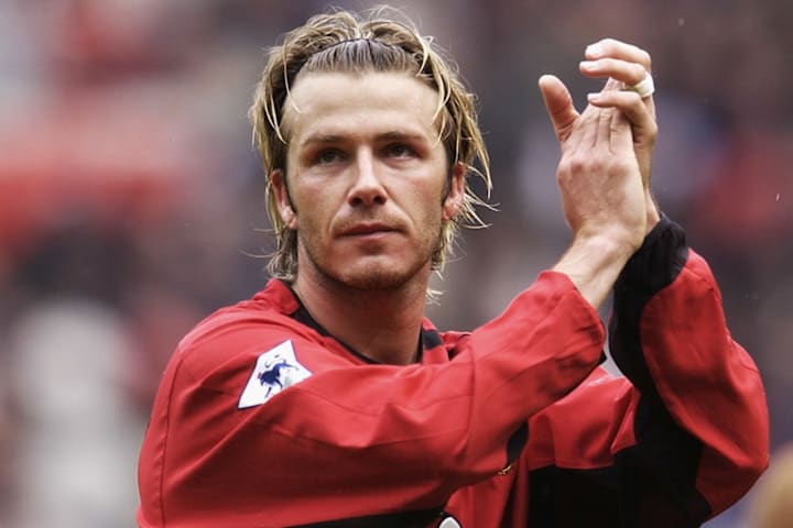 David Beckham of Manchester United applauds the fans