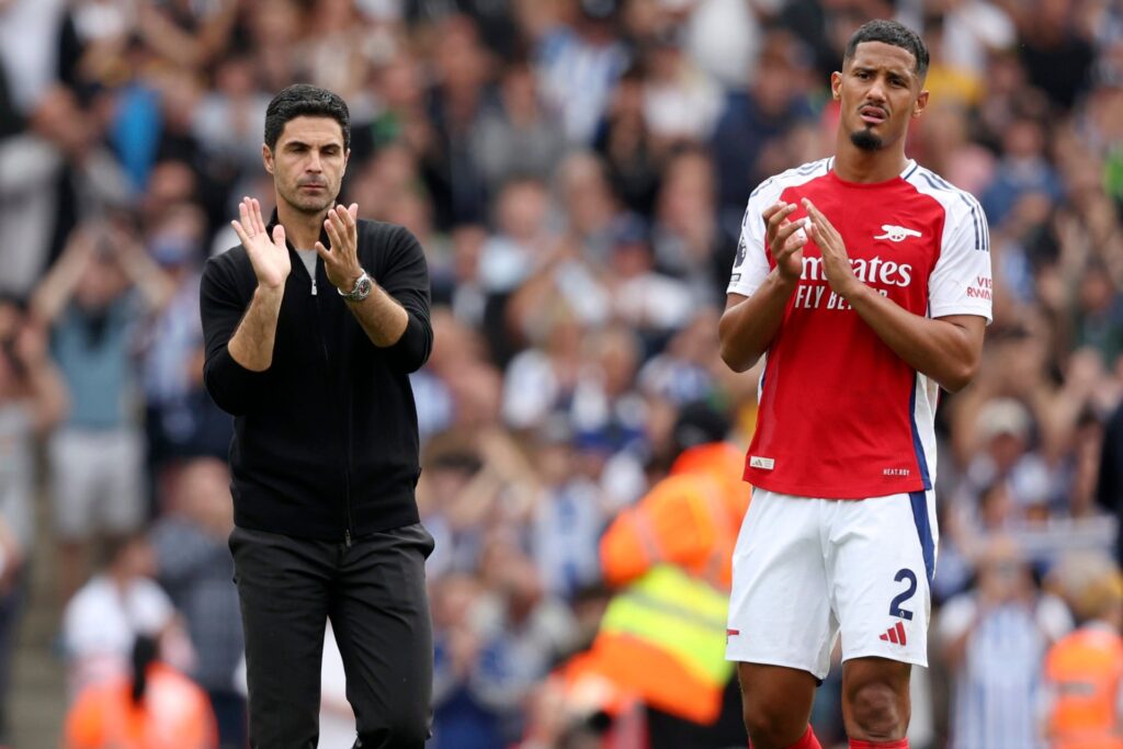 Mikel Arteta, Manager of Arsenal and William Saliba of Arsenal applauds the fans after the Premier League match between Arsenal FC and Brighton &am...