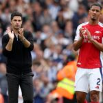 Mikel Arteta, Manager of Arsenal and William Saliba of Arsenal applauds the fans after the Premier League match between Arsenal FC and Brighton &am...