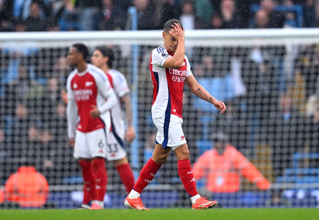 Leandro Trossard of Arsenal leaves the pitch after being shown a red card during the Premier League match between Manchester City FC and Arsenal FC...