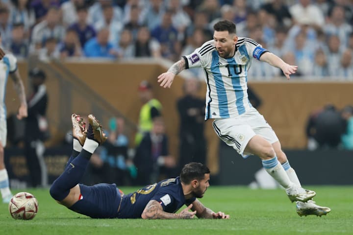 Theo Hernandez in World Cup final action for France against Lionel Messi