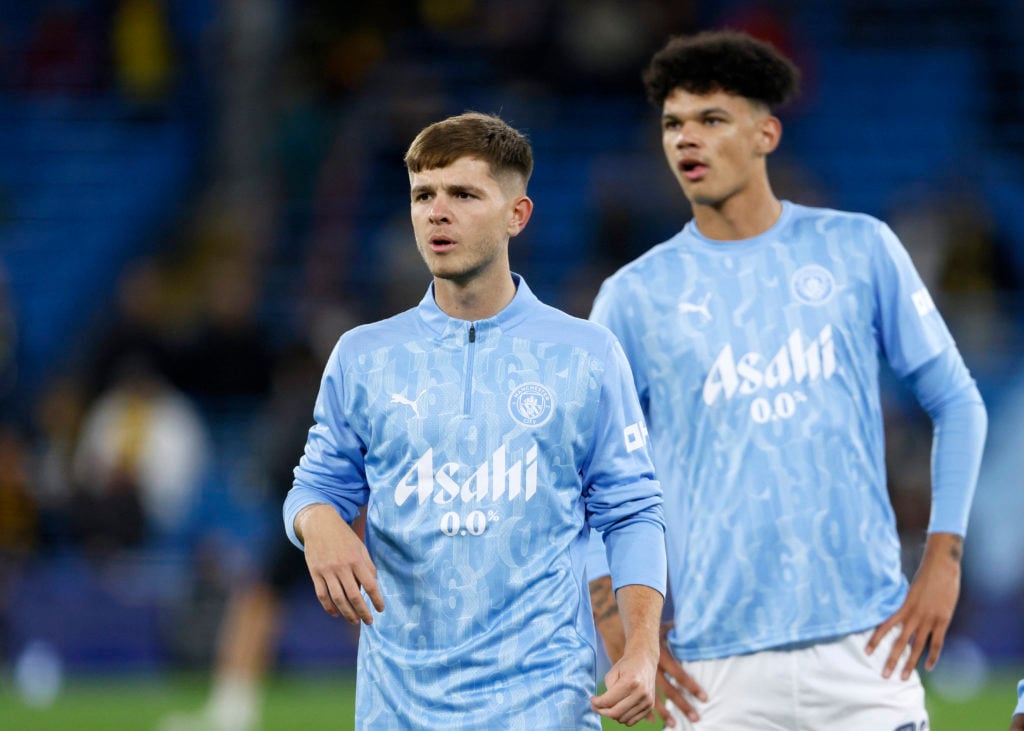 James McAtee of Manchester City and Nico O'Reilly of Manchester City warm up before the Carabao Cup Third Round match between Manchester City and W...