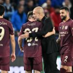 Manchester City's Spanish manager Pep Guardiola (2R) celebrates with Manchester City's English midfielder #87 James McAtee and team mates after the...