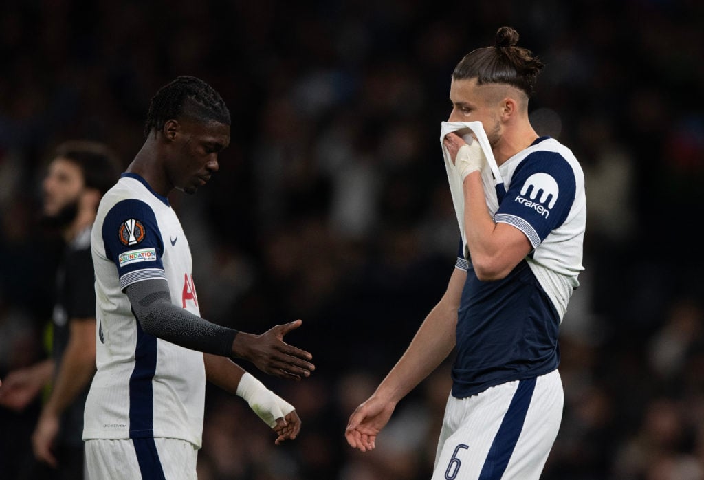 Radu Dragusin of Tottenham Hotspur reacts after being given a red card for a foul on Olavio Juninho of Qarabag FK during the UEFA Europa League 202...