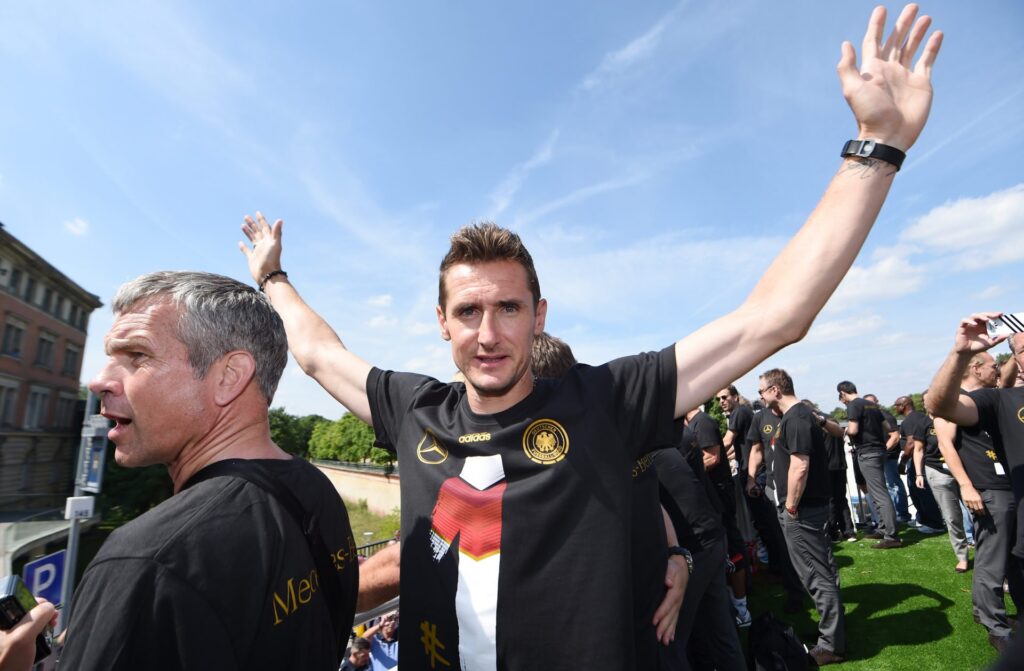 Miroslav Klose celebrates during the German team victory ceremony on July 15, 2014 in Berlin, Germany. Germany won the 2014 FIFA World Cup Brazil m...