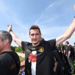 Miroslav Klose celebrates during the German team victory ceremony on July 15, 2014 in Berlin, Germany. Germany won the 2014 FIFA World Cup Brazil m...