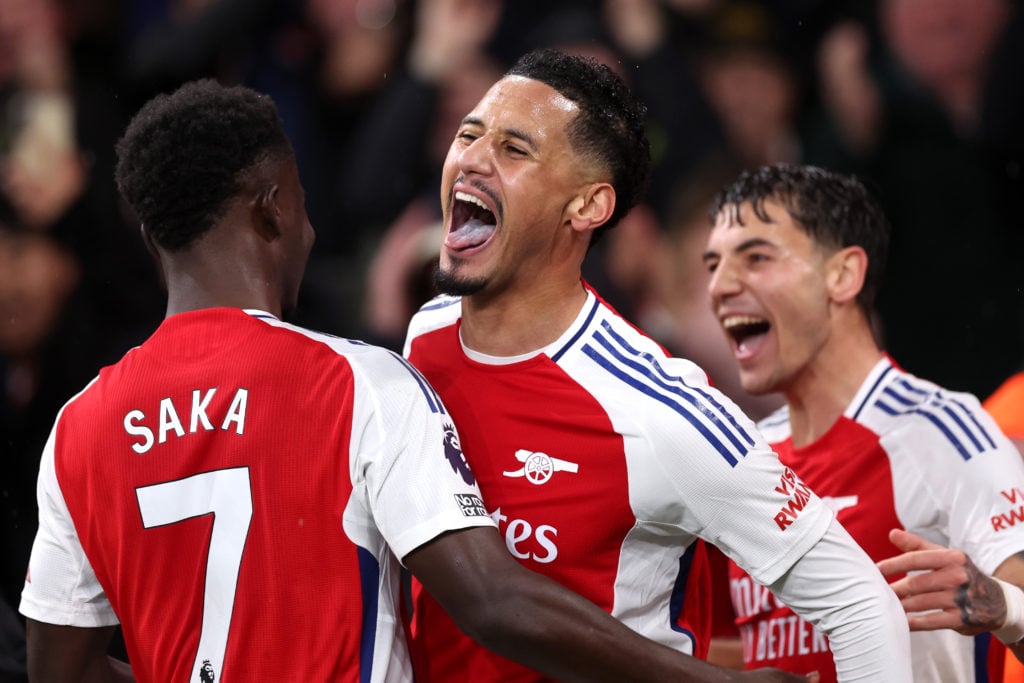 William Saliba of Arsenal celebrates scoring his team's second goal with teammates Bukayo Saka and Jakub Kiwior during the Premier League match bet...