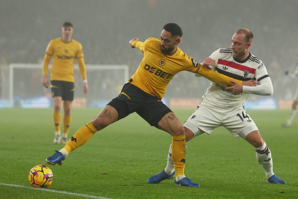 Matheus Cunha of Wolverhampton Wanderers is under pressure from Christian Eriksen of Manchester Utd during the Premier League match between Wolverh...