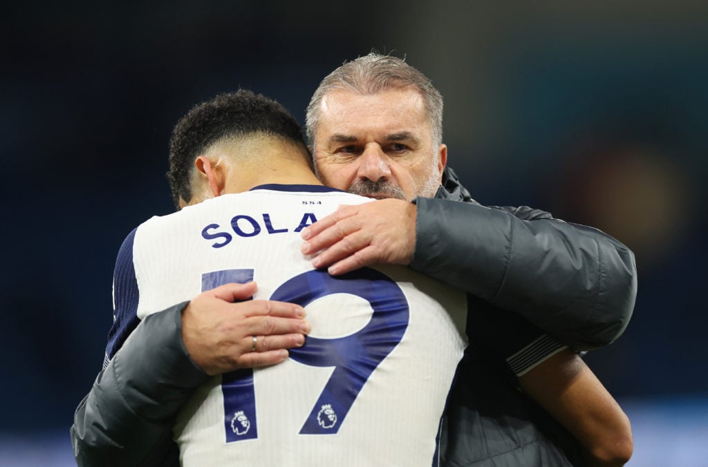 Ange Postecoglou, Manager of Tottenham Hotspur, interacts with Dominic Solanke of Tottenham Hotspur following the Premier League match between Manc...