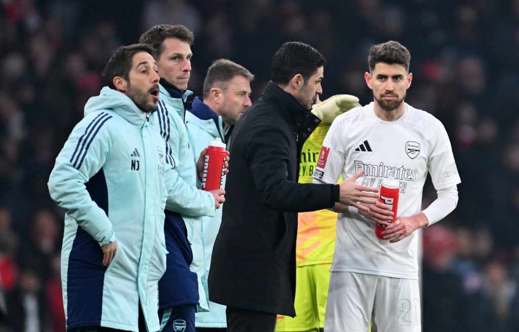 Mikel Arteta, Manager of Arsenal, interacts with Jorginho of Arsenal during the Emirates FA Cup Third Round match between Arsenal and Manchester Un...